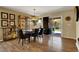 Cozy dining area with stylish lighting, hardwood floors, and sliding glass doors leading to the backyard at 759 Star Apple Ln, Las Vegas, NV 89178