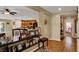 Open-concept entryway with decorative shelving, hardwood floors, and views into the kitchen and other living spaces at 759 Star Apple Ln, Las Vegas, NV 89178