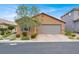Charming single-story home with desert landscaping, a brick-paved driveway, and a neutral stucco exterior at 759 Star Apple Ln, Las Vegas, NV 89178
