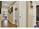 Hallway leading to bedrooms and bathrooms, freshly painted with wood flooring at 759 Star Apple Ln, Las Vegas, NV 89178