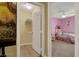 Hallway view showcasing open closet space and pink themed bedroom at 759 Star Apple Ln, Las Vegas, NV 89178