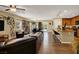 Spacious living room with hardwood floors, neutral walls, and an open layout that connects to the kitchen and dining area at 759 Star Apple Ln, Las Vegas, NV 89178