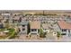 An aerial view shows houses in a suburban neighborhood with desert landscaping and a view of mountains in the background at 7977 Texas Hills St, Las Vegas, NV 89113