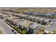 An aerial shot reveals the layout of a well-planned community featuring consistent home designs and manicured landscaping at 7977 Texas Hills St, Las Vegas, NV 89113