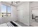 Bedroom featuring a bright window, spacious layout, and closet with sliding doors at 7977 Texas Hills St, Las Vegas, NV 89113