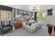 Stylish bedroom with a comfortable bed, accent wall, modern lighting, and a calming atmosphere at 7977 Texas Hills St, Las Vegas, NV 89113