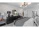 Elegant bedroom featuring a comfortable bed, a dresser, and a well-lit, serene ambiance at 7977 Texas Hills St, Las Vegas, NV 89113