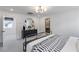 Bright bedroom showcasing modern decor, contemporary lighting, and stylish black dresser at 7977 Texas Hills St, Las Vegas, NV 89113