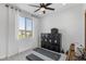 Home gym with fitness equipment, natural light, and a ceiling fan at 7977 Texas Hills St, Las Vegas, NV 89113