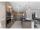 Well-equipped kitchen with modern appliances, a large island, and ample counter space for cooking and entertaining at 7977 Texas Hills St, Las Vegas, NV 89113