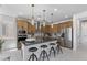 Spacious kitchen featuring stainless steel appliances, a center island with seating, and ample cabinet space at 7977 Texas Hills St, Las Vegas, NV 89113