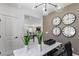 Open-concept living room with stylish decor, modern lighting, and comfortable seating at 7977 Texas Hills St, Las Vegas, NV 89113