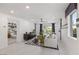 Bright living room with modern decor, stylish furnishings, and access to outdoor space at 7977 Texas Hills St, Las Vegas, NV 89113