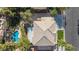 This aerial view of the home features a backyard oasis with pool, spa, and outdoor seating at 8121 Eagle Clan Ct, Las Vegas, NV 89131