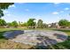 Community basketball court with a full court, trees, and landscaping surrounding the area at 8121 Eagle Clan Ct, Las Vegas, NV 89131