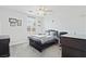 Bedroom with a ceiling fan, neutral walls, carpeted floors, and a window with plantation shutters at 8121 Eagle Clan Ct, Las Vegas, NV 89131