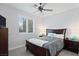 Cozy bedroom features a ceiling fan, a window with blinds, and carpeted floors at 8121 Eagle Clan Ct, Las Vegas, NV 89131