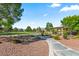 Beautiful community park with a pergola, picnic tables, walking path, and lush landscaping at 8121 Eagle Clan Ct, Las Vegas, NV 89131