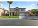 Charming two-story home with a well-manicured lawn and a three-car garage at 8121 Eagle Clan Ct, Las Vegas, NV 89131
