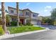 Well-maintained two-story home with a manicured lawn, lush plantings, and a three car garage at 8121 Eagle Clan Ct, Las Vegas, NV 89131