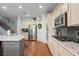 Bright kitchen features stainless appliances, granite countertops, and hardwood flooring at 8121 Eagle Clan Ct, Las Vegas, NV 89131