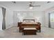 Spacious main bedroom features a ceiling fan, natural light, and a decorative wood bed frame at 8121 Eagle Clan Ct, Las Vegas, NV 89131