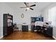 Dedicated office space with hardwood floors, ample storage, and a ceiling fan at 8121 Eagle Clan Ct, Las Vegas, NV 89131