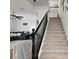 Carpeted staircase with dark wood railing leading to the upper level at 8121 Eagle Clan Ct, Las Vegas, NV 89131