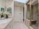 Bathroom featuring a glass enclosed shower with marble bench and a sink at 8196 Horseshoe Bend Ln, Las Vegas, NV 89113