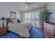 Cozy bedroom with a plush queen bed, shuttered windows, and wood furniture at 8196 Horseshoe Bend Ln, Las Vegas, NV 89113