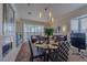 Cozy dining area with modern table set, bright natural light, and beautiful views of the outdoors at 8196 Horseshoe Bend Ln, Las Vegas, NV 89113