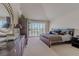 Serene main bedroom suite with a comfortable bed, walk out balcony, and ample closet space at 8196 Horseshoe Bend Ln, Las Vegas, NV 89113