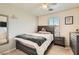 Nice bedroom with a bed, ceiling fan, dresser and a closet at 8252 Pearl Oasis Ct, Las Vegas, NV 89139