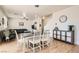 Open concept dining area with view to the living room and modern light fixture at 8252 Pearl Oasis Ct, Las Vegas, NV 89139