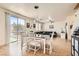 Open concept dining area with view to the living room and access to the backyard at 8252 Pearl Oasis Ct, Las Vegas, NV 89139