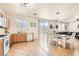 Open-concept kitchen area with an eat-in dining table next to sliding doors to the backyard and patio at 8252 Pearl Oasis Ct, Las Vegas, NV 89139