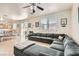 Open concept living room with dining area, sliding glass doors to the backyard, and lots of natural light at 8252 Pearl Oasis Ct, Las Vegas, NV 89139