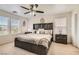 Comfortable main bedroom with large bed, ceiling fan, and dual windows for natural light at 8252 Pearl Oasis Ct, Las Vegas, NV 89139