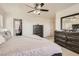 Spacious main bedroom featuring two dressers, a closet, and a comfortable king-size bed at 8252 Pearl Oasis Ct, Las Vegas, NV 89139