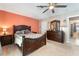 Bedroom featuring a wooden bed frame and dresser with mirror at 8700 Isola Dr, Las Vegas, NV 89117
