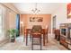 Bright dining area featuring modern lighting, and neutral tile flooring at 8700 Isola Dr, Las Vegas, NV 89117