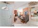 Inviting foyer leading to a cozy living room with a brick fireplace and comfortable seating at 8700 Isola Dr, Las Vegas, NV 89117