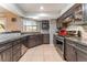 Modern kitchen with sleek countertops, stainless steel appliances and tile flooring at 8700 Isola Dr, Las Vegas, NV 89117