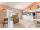 Open living area with tile floors connecting to the kitchen and backyard at 8700 Isola Dr, Las Vegas, NV 89117