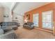 Bright and airy living room with large windows, plush seating, and neutral décor at 8700 Isola Dr, Las Vegas, NV 89117