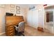 Inviting office space with a roll-top desk, adjacent to a closet and hallway at 8700 Isola Dr, Las Vegas, NV 89117