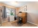 Cozy office space featuring a classic roll-top desk and natural light from the window at 8700 Isola Dr, Las Vegas, NV 89117