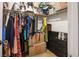 Organized walk-in closet with hanging clothes, storage boxes and drawers at 8884 Perfect Diamond Ct, Las Vegas, NV 89129