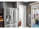 Spacious kitchen showcases stainless steel refrigerator and seamless access to patio at 8884 Perfect Diamond Ct, Las Vegas, NV 89129