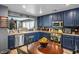 Beautiful kitchen with laminate floors, stainless steel appliances and breakfast table at 8884 Perfect Diamond Ct, Las Vegas, NV 89129